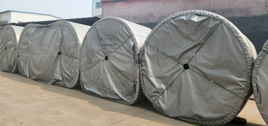 Heavy-duty rubber conveyor belt rolls ready for shipment at Baoding Huaxing factory