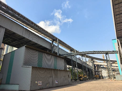 Panoramic view of a tubular pipe conveyor belt system for environmentally friendly bulk material transportation.